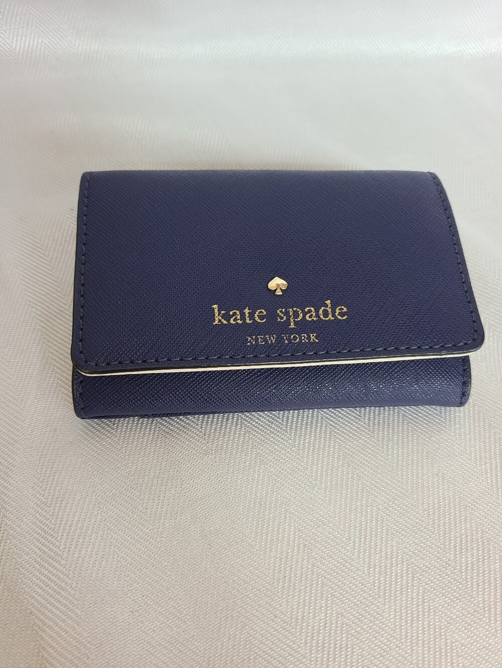 kate spade navy Saffiano leather trifold wallet with gold logo